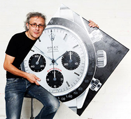 Didier Vall� met een schilderij van een Rolex Daytona